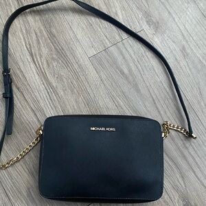 Michael Kors Elegant Black and Gold Crossbody